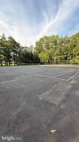 a front view of a house with a garden and plants