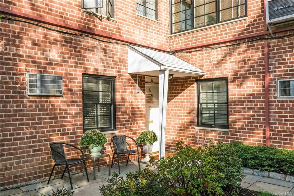 Welcome home to 181 Purchase Street, a private corner unit with a private entrance and front patio, wonderful outdoor space!