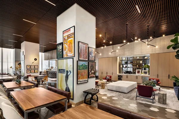 a living room with furniture and a lamp