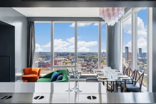 a view of a dining room with furniture window and outside view