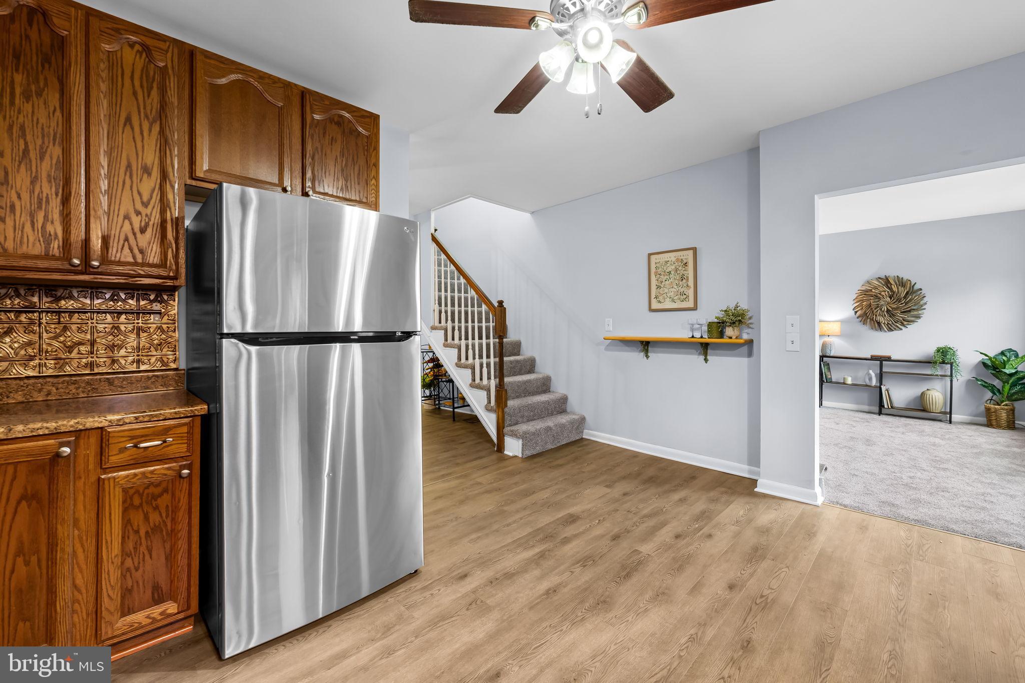 735 Main Street Delta, PA 17314 - Photo 12 of 35 a view of a kitchen with refrigerator and wooden floor