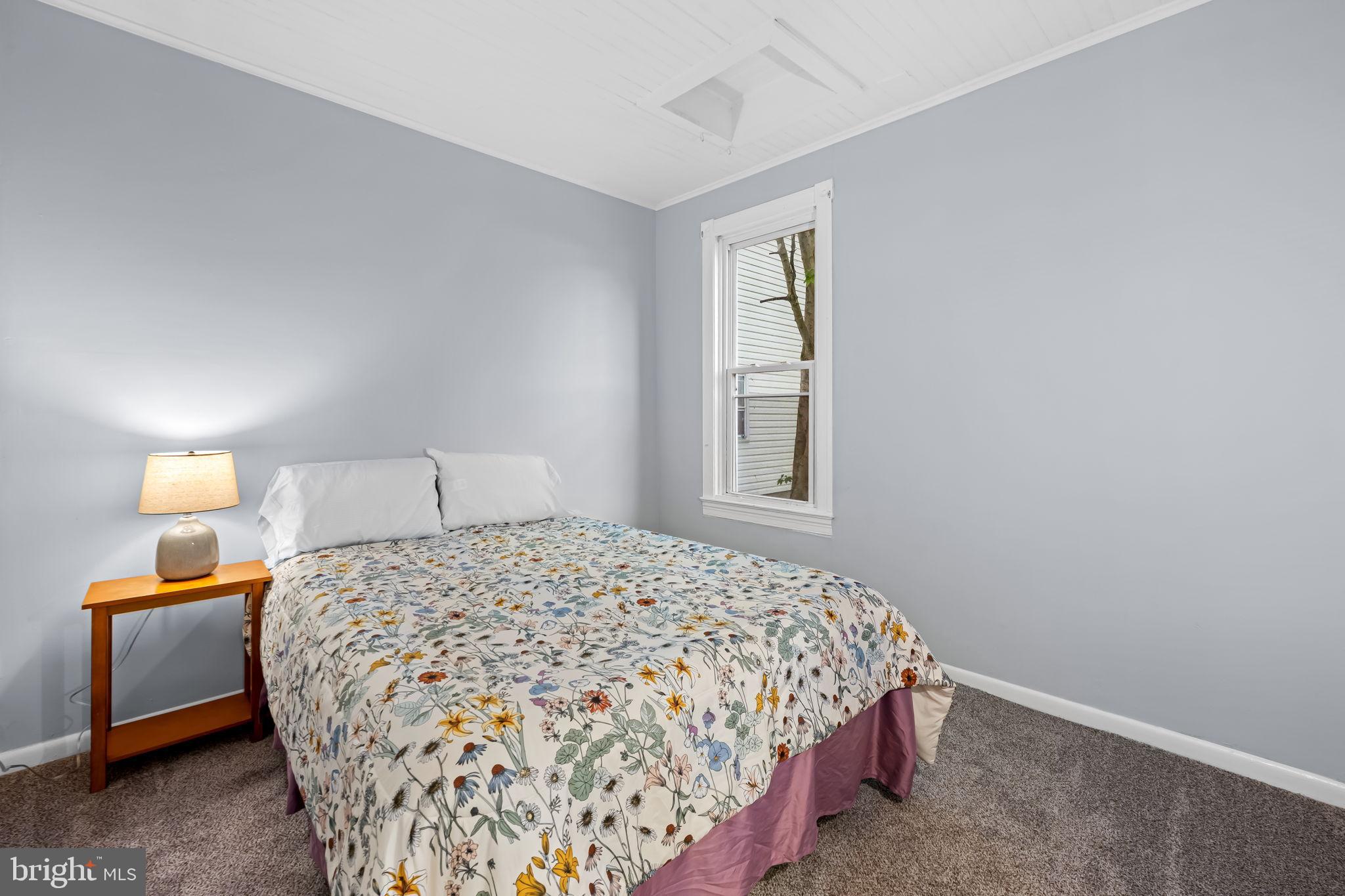 735 Main Street Delta, PA 17314 - Photo 16 of 35 a bedroom with a bed and a window