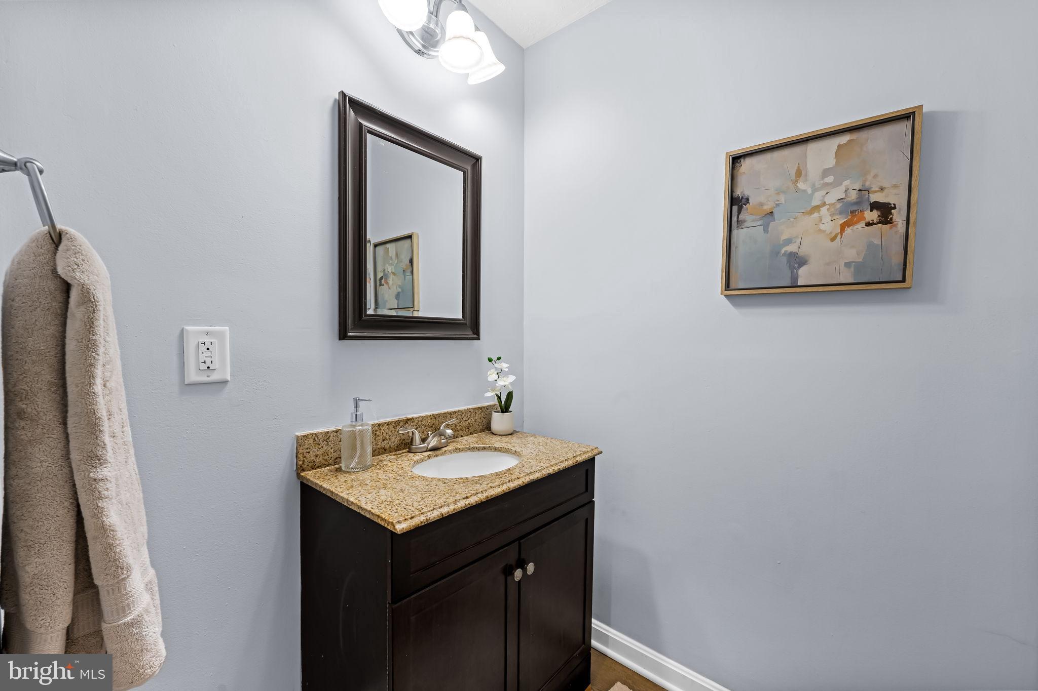 735 Main Street Delta, PA 17314 - Photo 18 of 35 a bathroom with a sink and a mirror