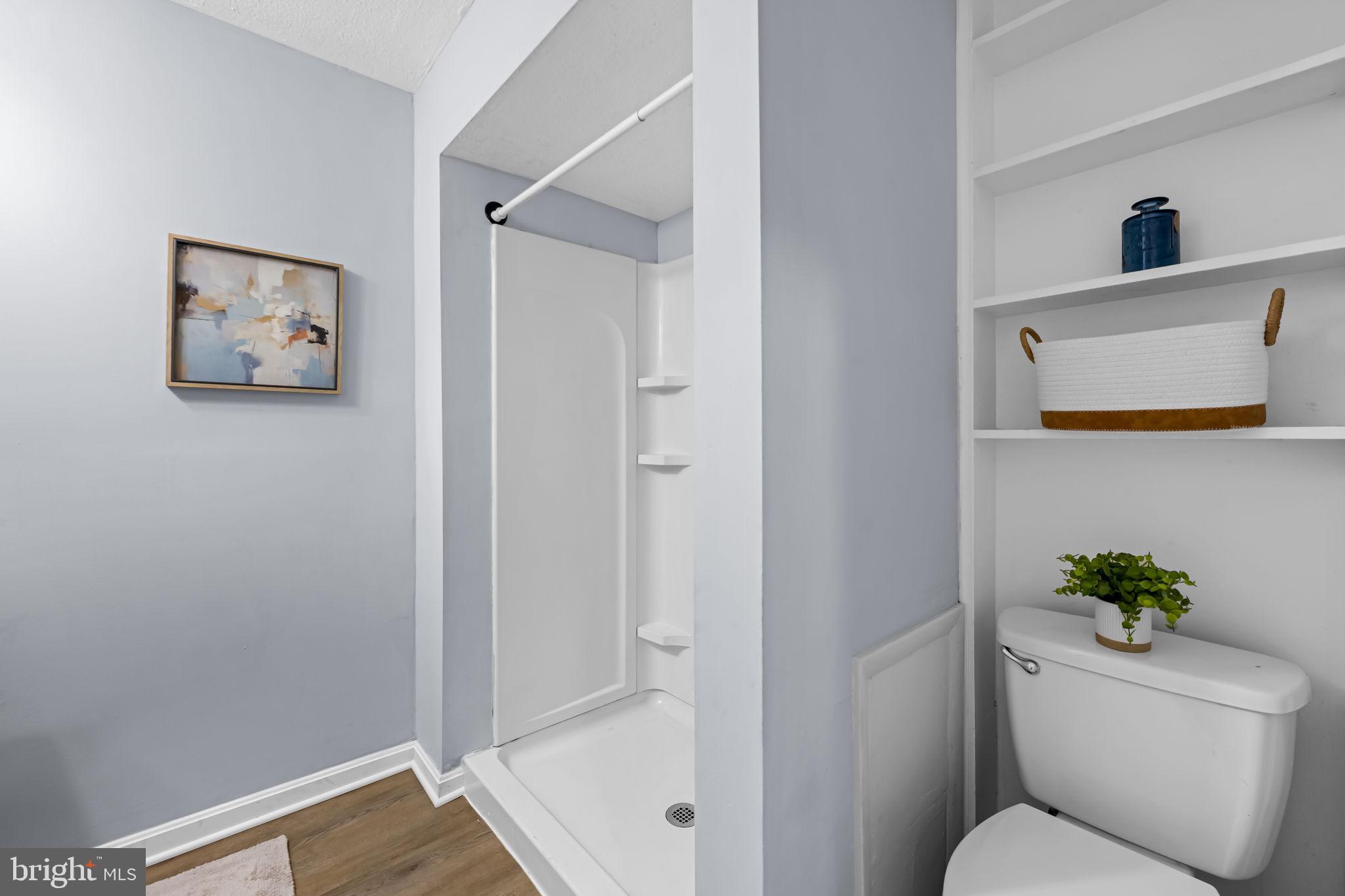 735 Main Street Delta, PA 17314 - Photo 19 of 35 a bathroom with a toilet and a shower