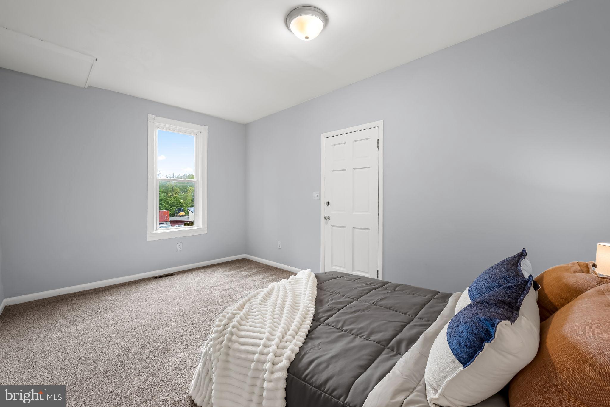 735 Main Street Delta, PA 17314 - Photo 20 of 35 a bedroom with a bed and a window