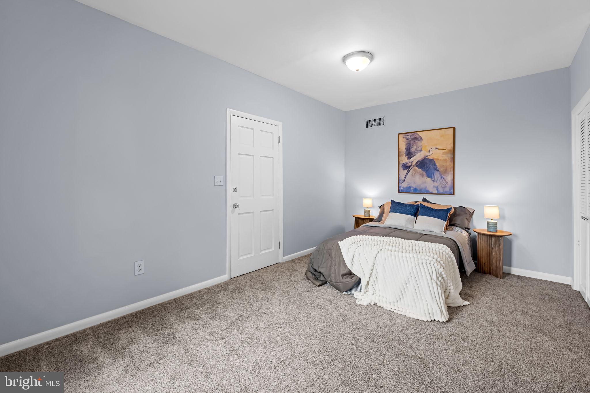 735 Main Street Delta, PA 17314 - Photo 21 of 35 a bedroom with a bed and painting on the wall