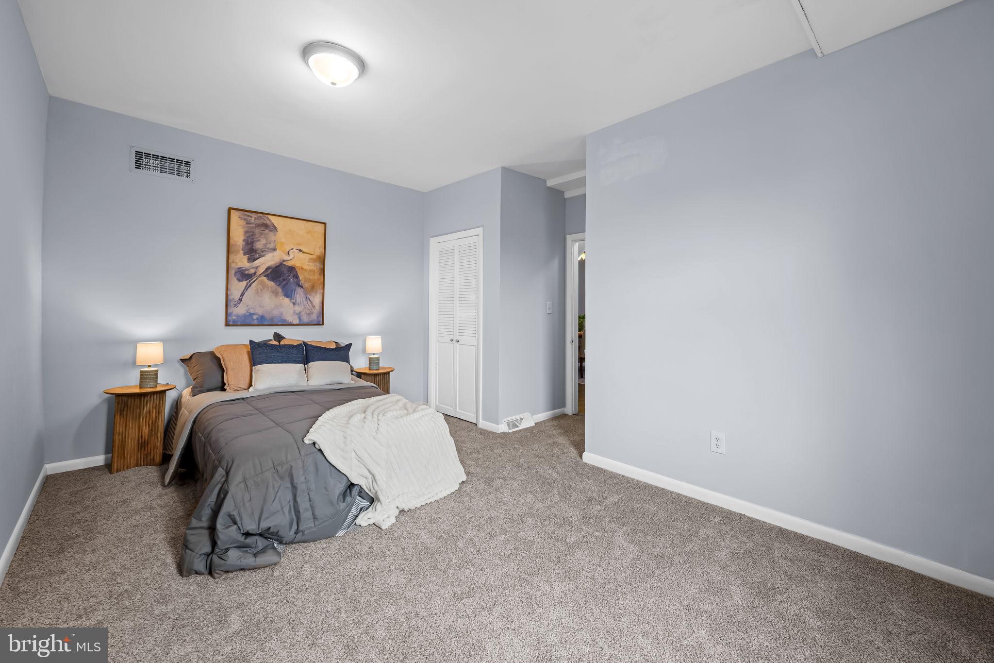 735 Main Street Delta, PA 17314 - Photo 22 of 35 a bed room with a bed and a night stand