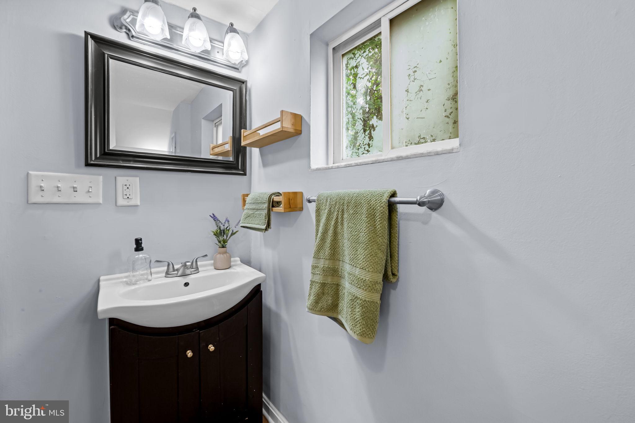 735 Main Street Delta, PA 17314 - Photo 25 of 35 a bathroom with a sink and a mirror