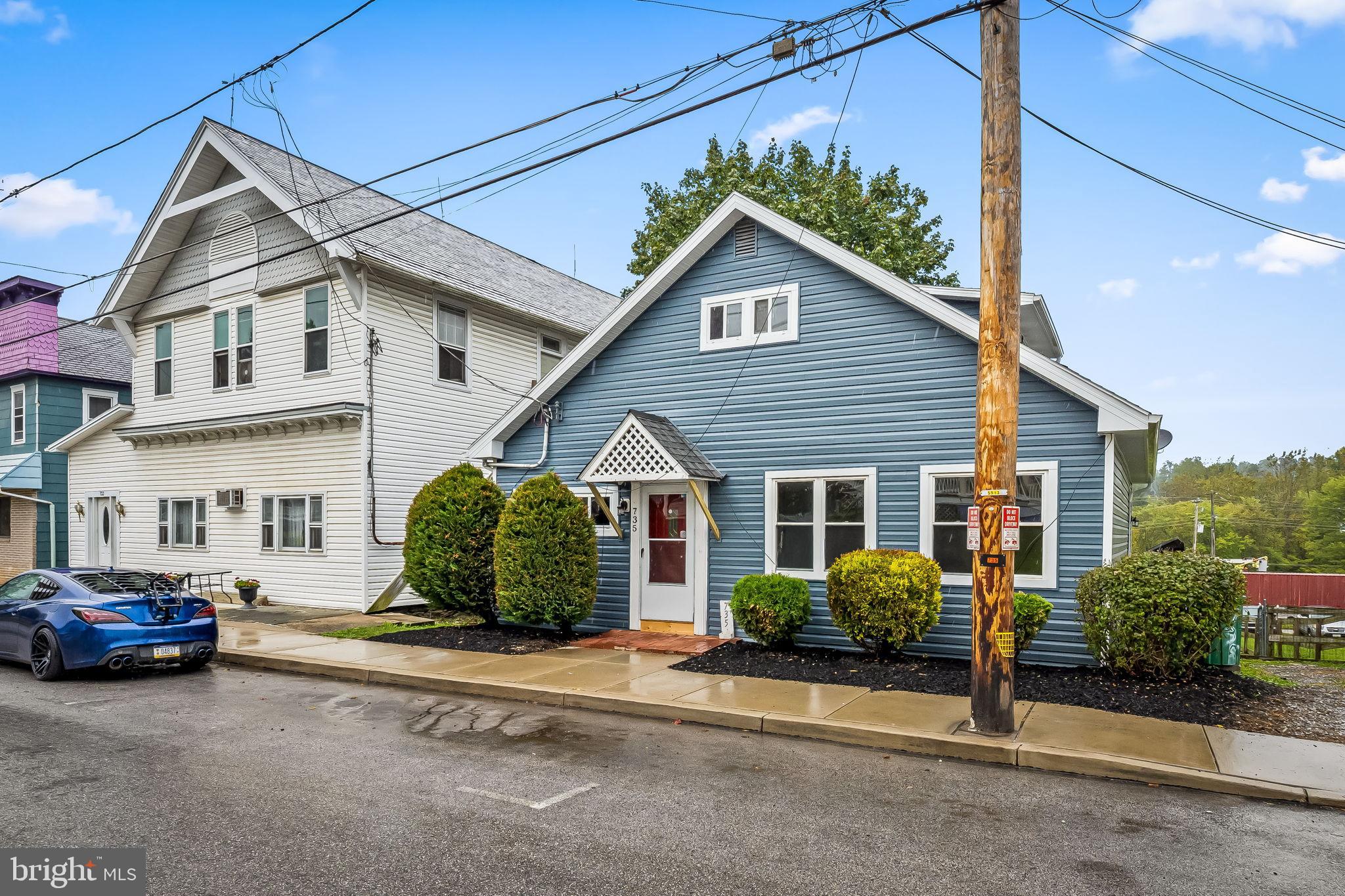 735 Main Street Delta, PA 17314 - Photo 3 of 35 a front view of a house with a garden