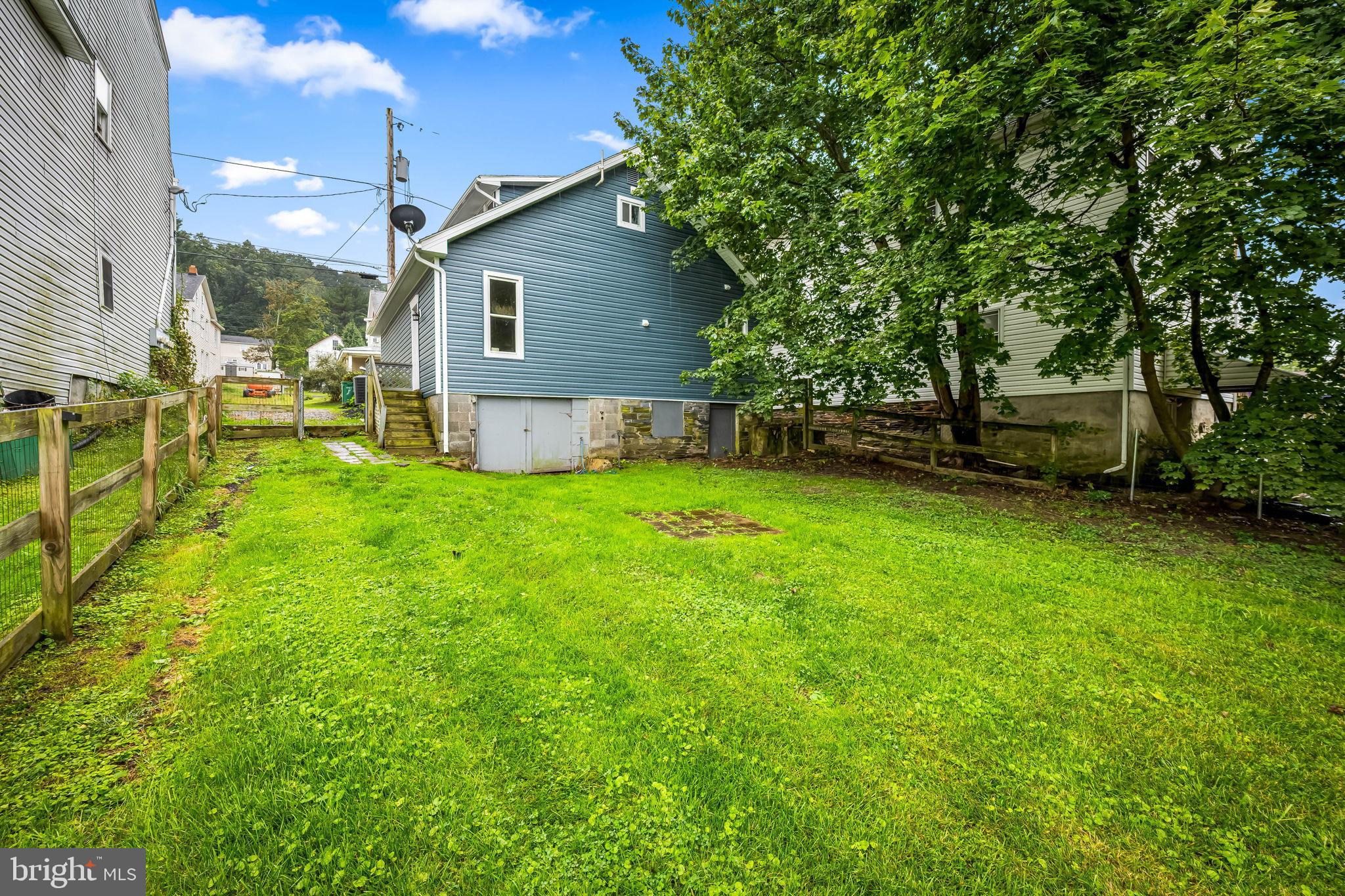 735 Main Street Delta, PA 17314 - Photo 32 of 35 a view of a backyard with a garden and trees