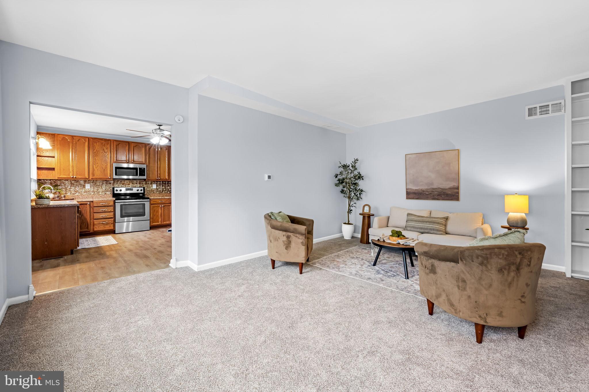 735 Main Street Delta, PA 17314 - Photo 8 of 35 a living room with furniture and a flat screen tv