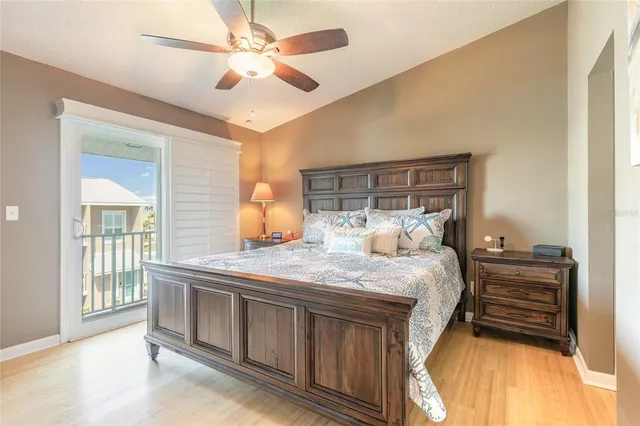 a bed room with a bed and a chandelier