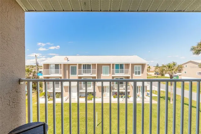 a view of a large building with a balcony