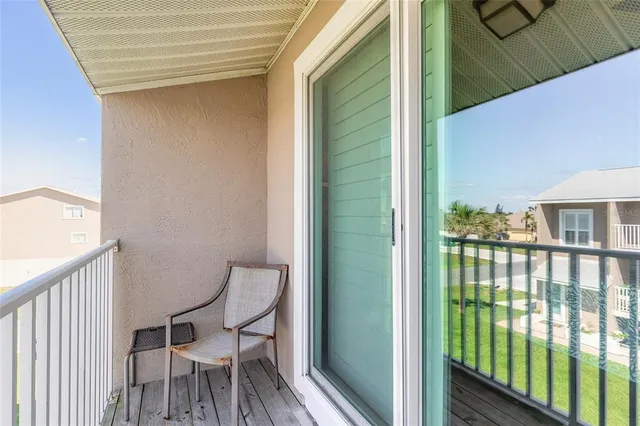 a view of a balcony with chairs