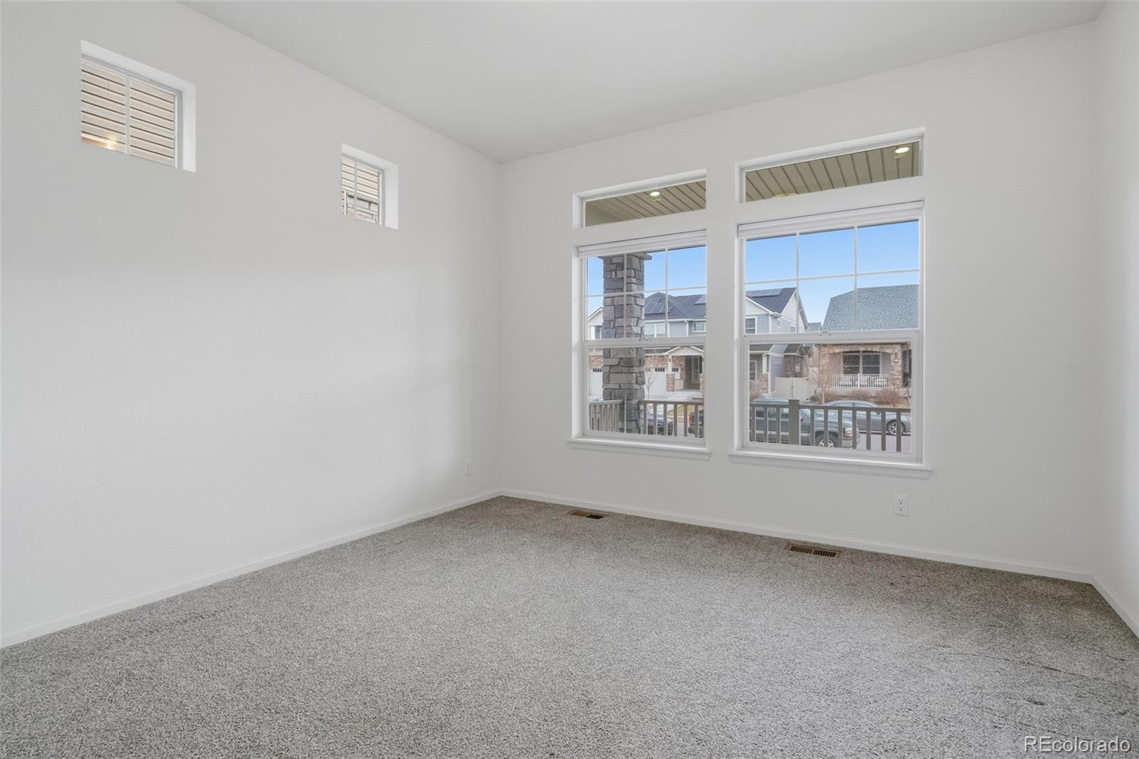 5017 Liverpool Street Denver, CO 80249 - Photo 20 of 42 a view of an empty room with a window