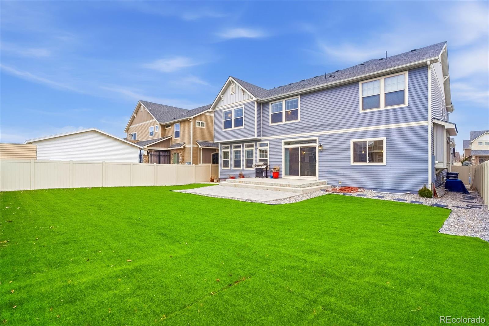 5017 Liverpool Street Denver, CO 80249 - Photo 38 of 42 a front view of a house with a yard