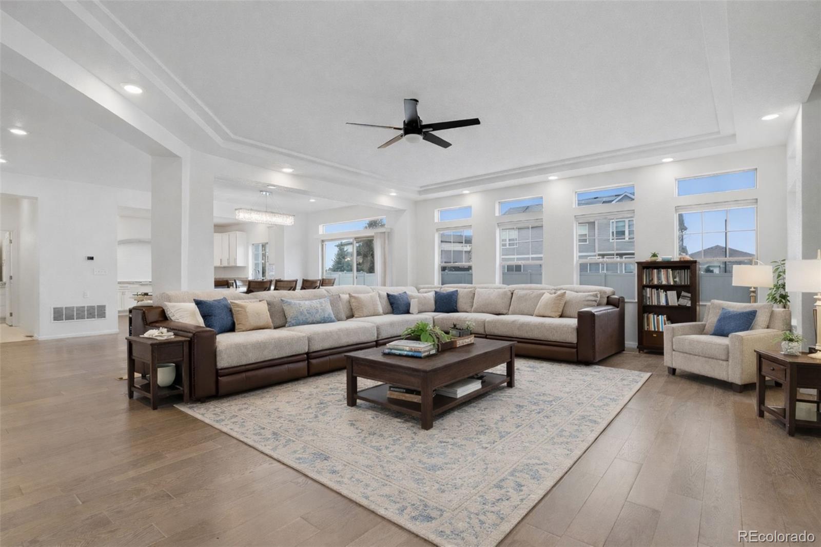 5017 Liverpool Street Denver, CO 80249 - Photo 6 of 42 a living room with furniture and a large window