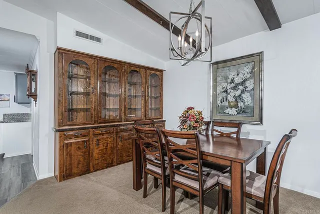 a view of kitchen with furniture and a ceiling fan