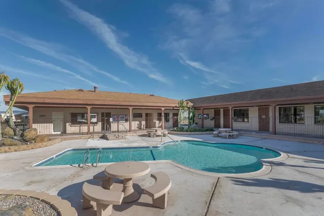 a room with lots of chairs and mirrors
