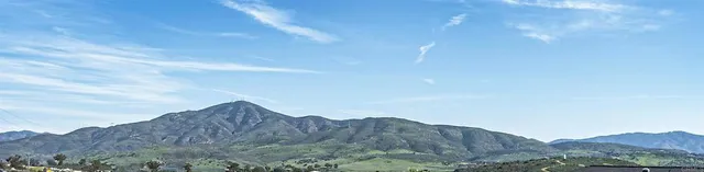a kitchen with center island with the sink