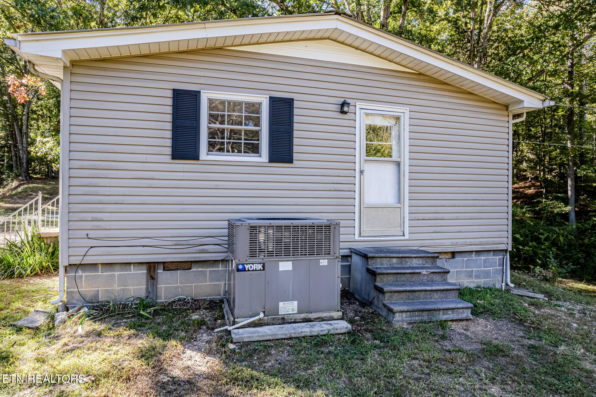 118 County Road 182 Decatur, TN 37322 - Photo 8 of 27 a view of a house with a yard and plants