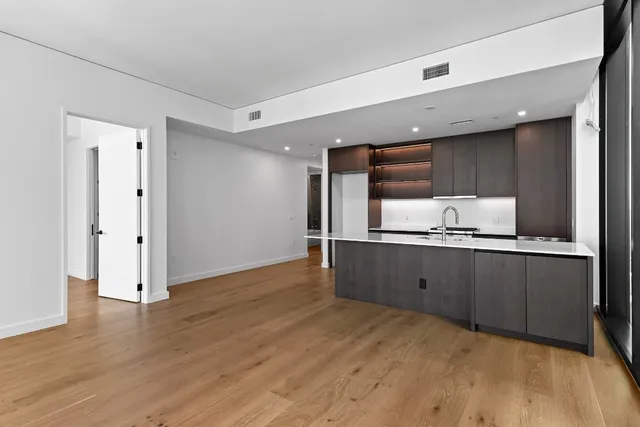 a kitchen with a sink and a refrigerator