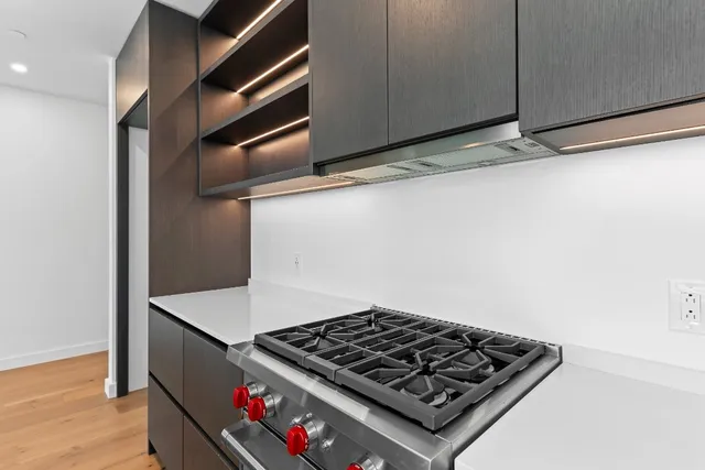 a view of an empty room with windows