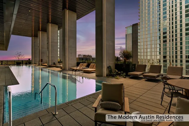 a couple of chairs sitting in front of a building