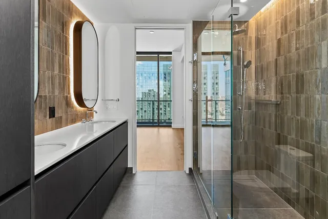 a living room with furniture a rug and a large window