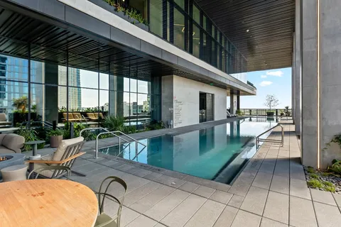 a lobby with furniture and floor to ceiling window