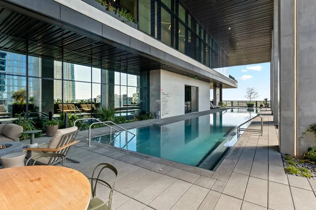 a lobby with furniture and floor to ceiling window