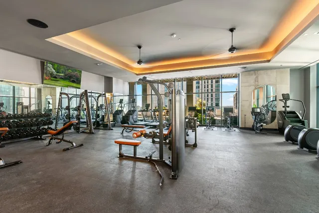 a view of a bedroom with furniture and window