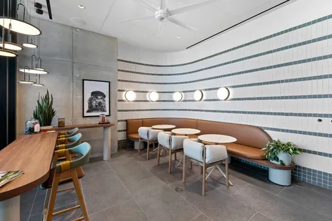 a view of a porch with furniture and garden