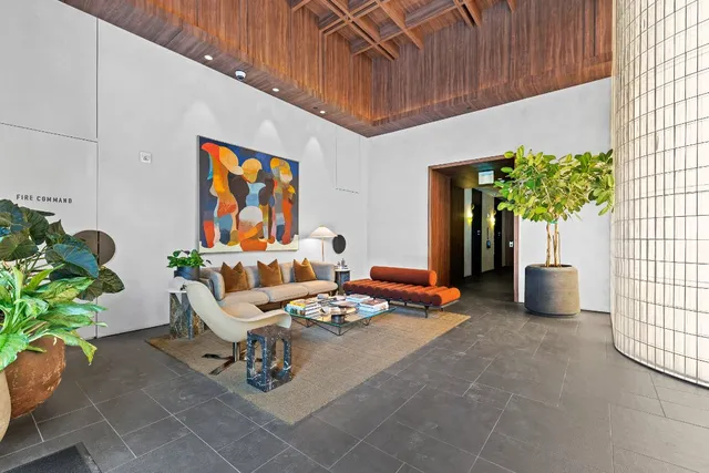a view of a hallway with wooden shelves