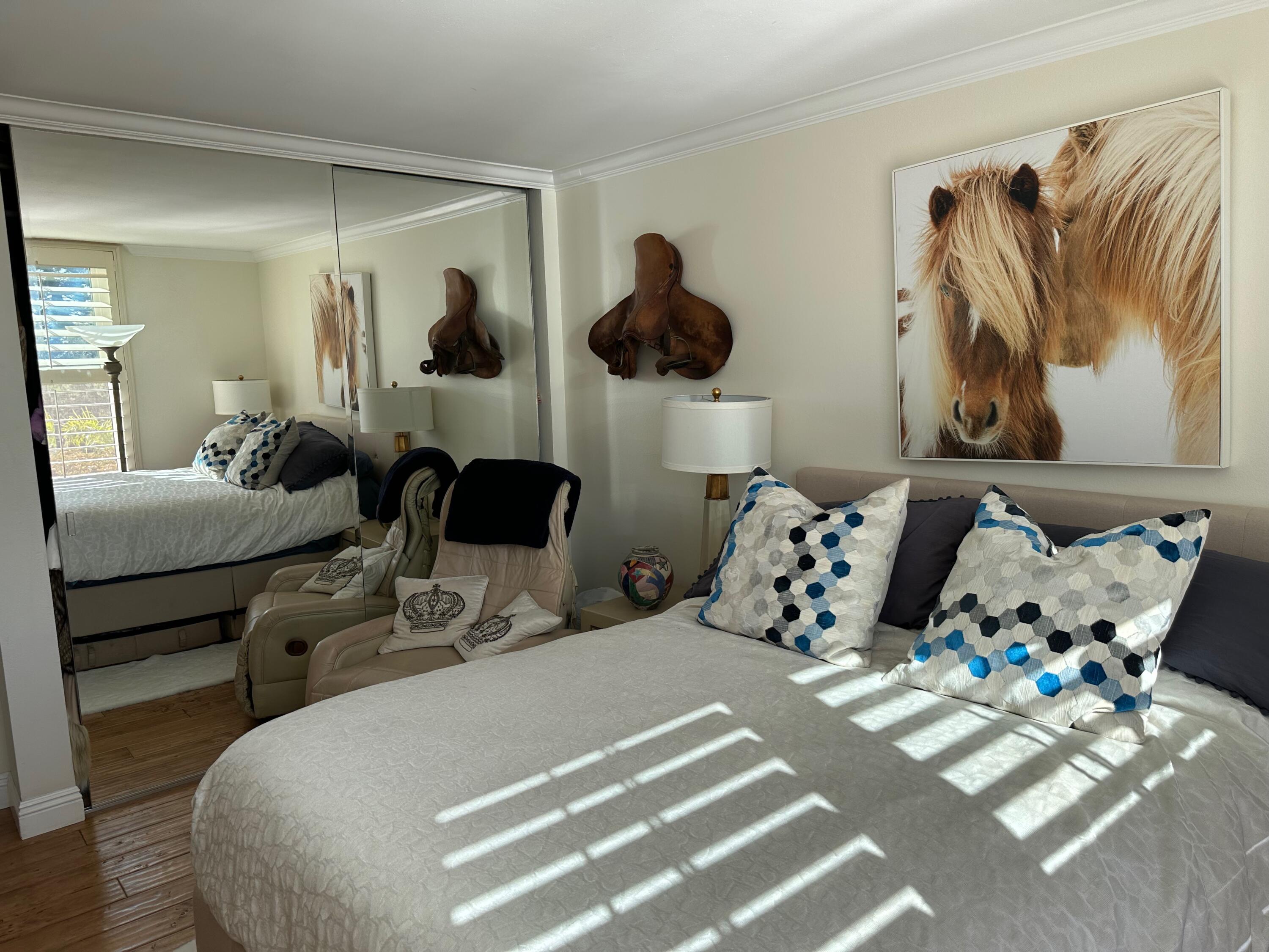 1220 Coast Village Road, Unit 208 Montecito, CA 93108 - Photo 7 of 11 a bedroom with bed and window