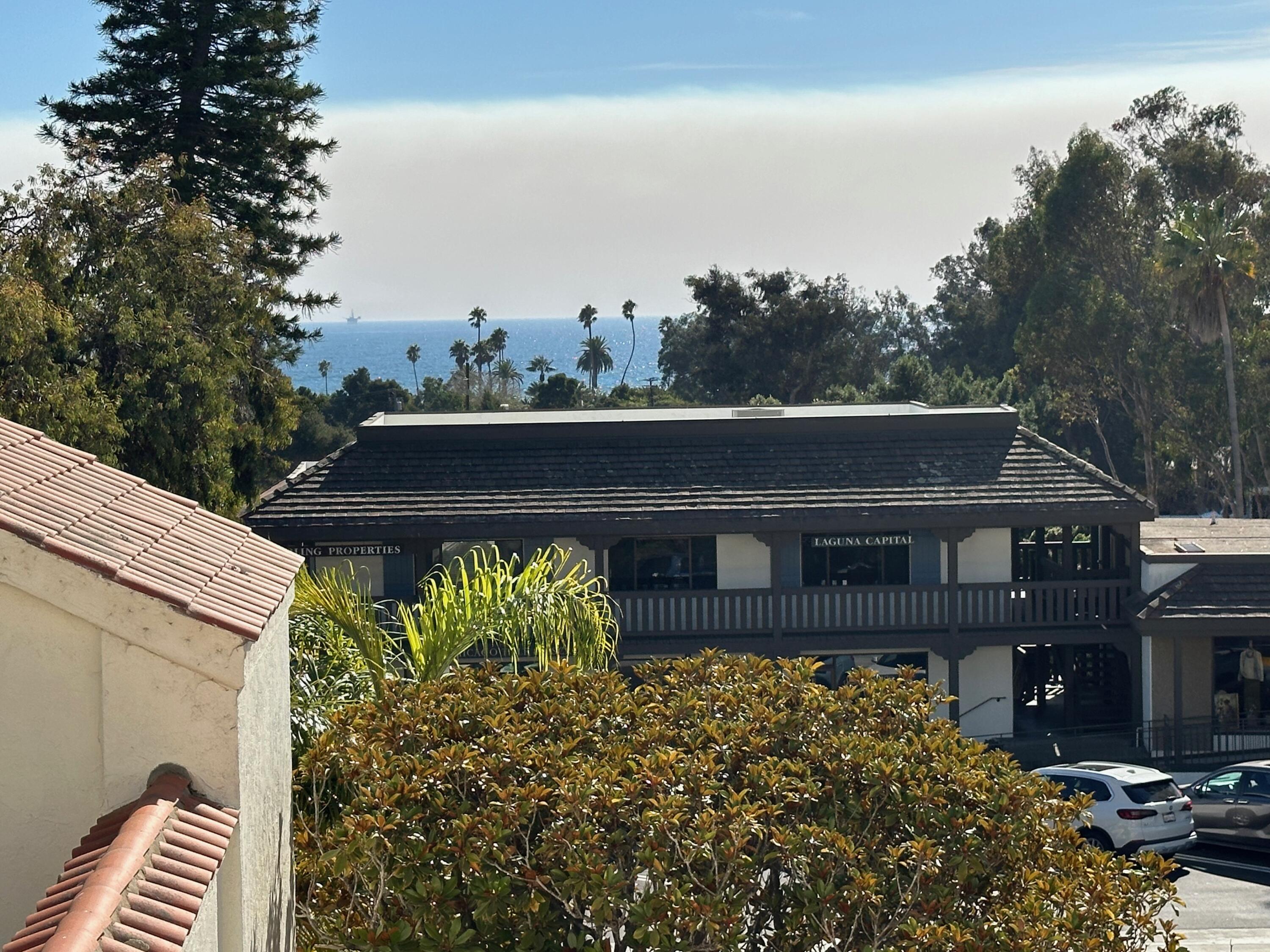 1220 Coast Village Road, Unit 208 Montecito, CA 93108 - Photo 10 of 11 a view of a chairs and table on the house