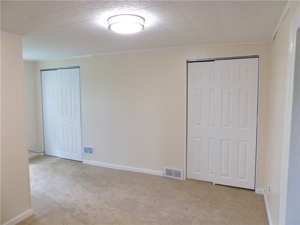 836 Little Summit Road Vanderbilt, PA 15486 - Photo 13 of 14 an empty room with closet area