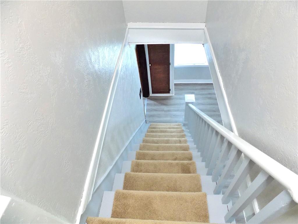 836 Little Summit Road Vanderbilt, PA 15486 - Photo 10 of 14 a view of staircase with wooden floor and white walls