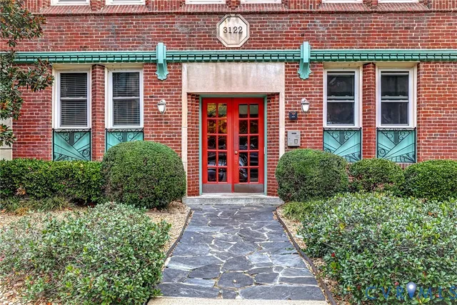 a kitchen with stainless steel appliances granite countertop a stove and a sink