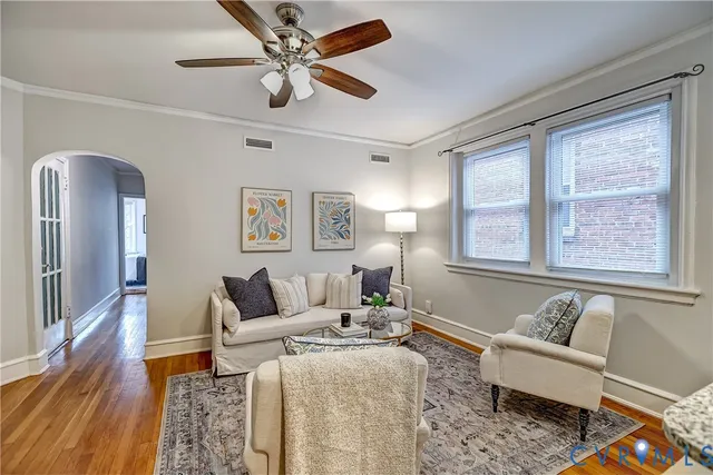 a bathroom with a granite countertop sink vanity mirror and a bathtub
