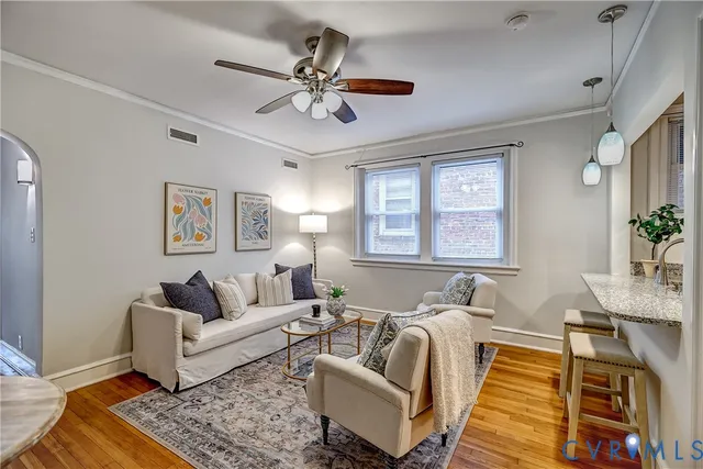 a bathroom with a granite countertop sink a mirror and a shower