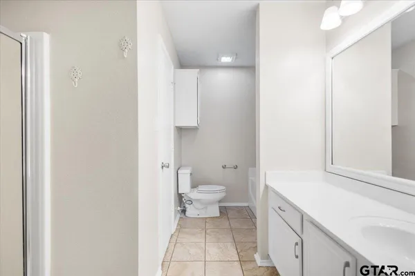a white bath tub sitting next to a white toilet