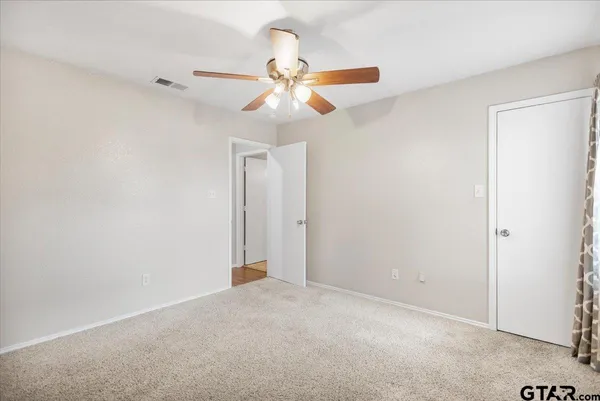 an empty room with wooden floor