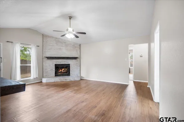 a kitchen with stainless steel appliances granite countertop a sink and a stove