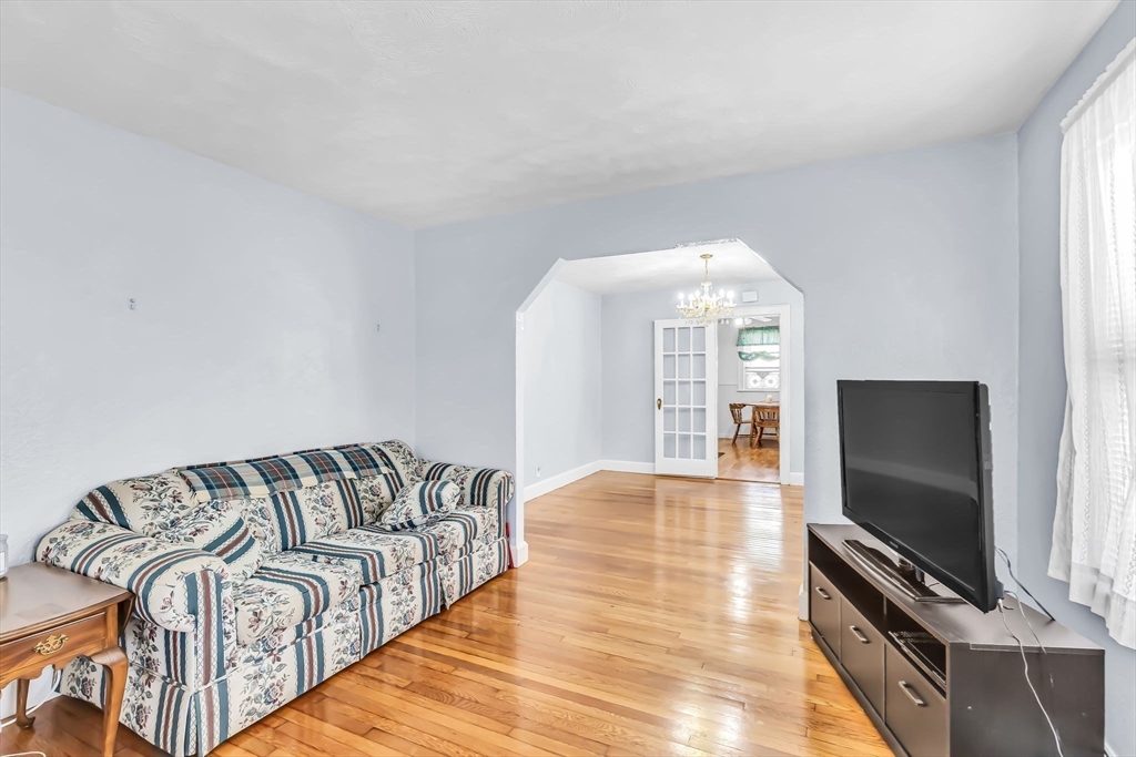 44 Cherrelyn Street Springfield, MA 01104 - Photo 13 of 36 a view of a livingroom with wooden floor and a flat screen tv