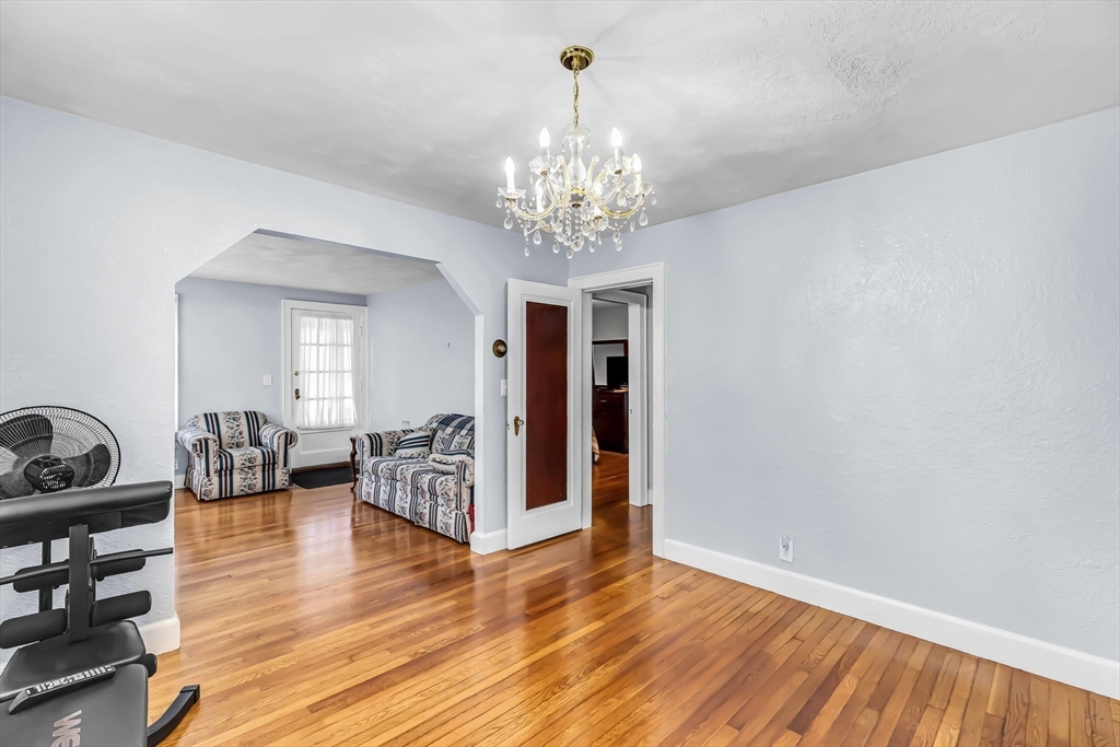 44 Cherrelyn Street Springfield, MA 01104 - Photo 16 of 36 a living room with furniture and a chandelier