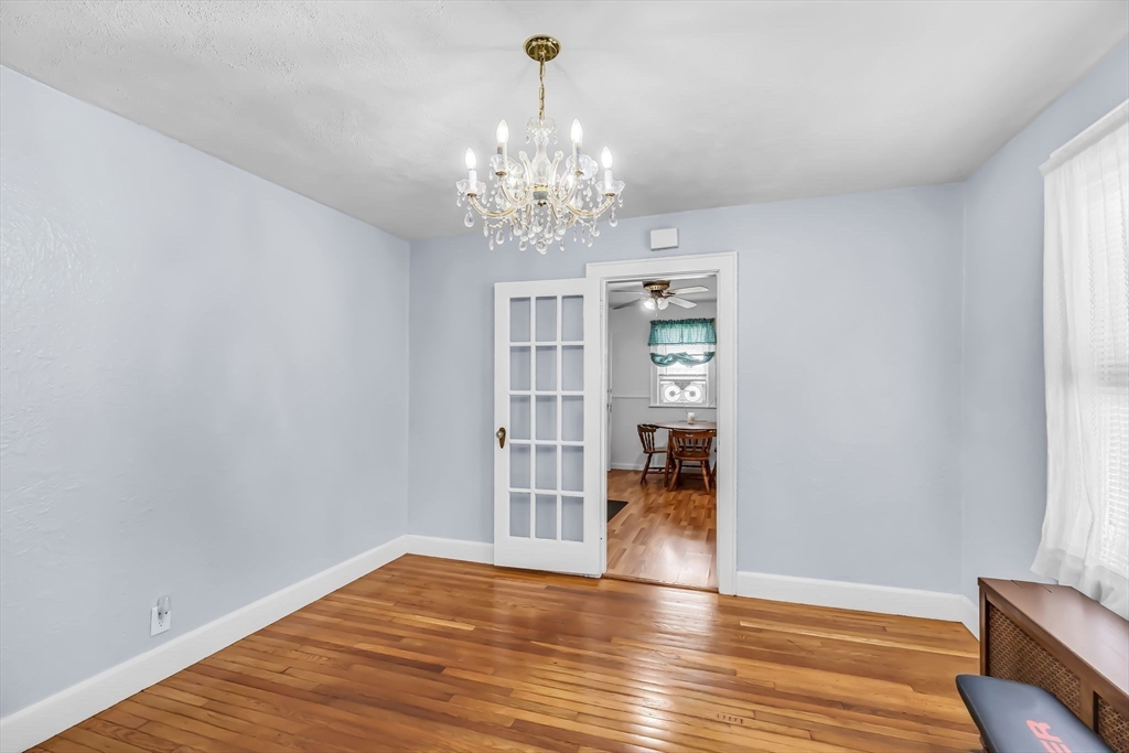 44 Cherrelyn Street Springfield, MA 01104 - Photo 17 of 36 a view of an empty room with wooden floor and a window