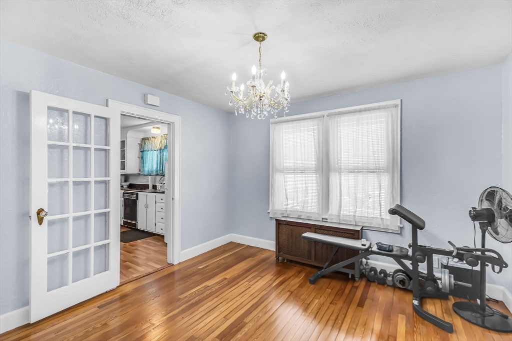 44 Cherrelyn Street Springfield, MA 01104 - Photo 18 of 36 a living room with furniture a window and wooden floor