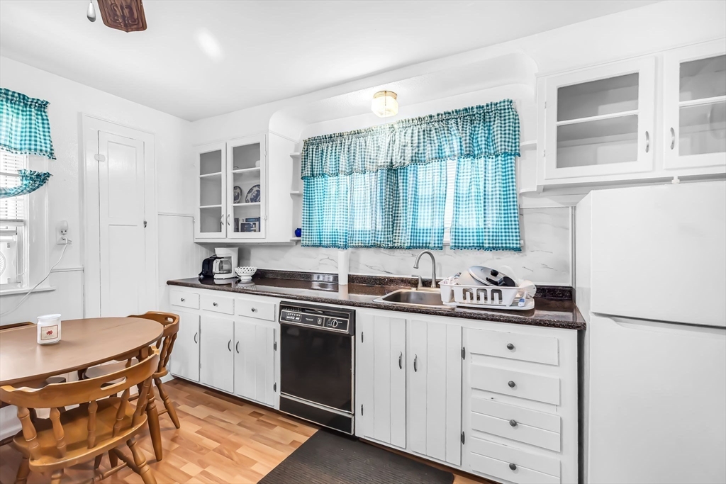 44 Cherrelyn Street Springfield, MA 01104 - Photo 20 of 36 a kitchen with a sink stove and cabinets