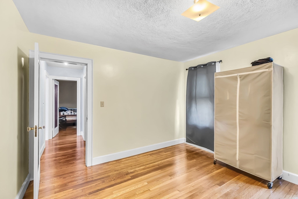 44 Cherrelyn Street Springfield, MA 01104 - Photo 26 of 36 a view of empty room with wooden floor